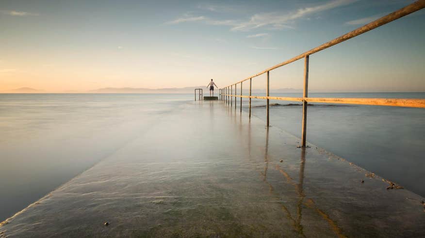 Person standing at the end of Salterstown Pier in Louth on a misty morning