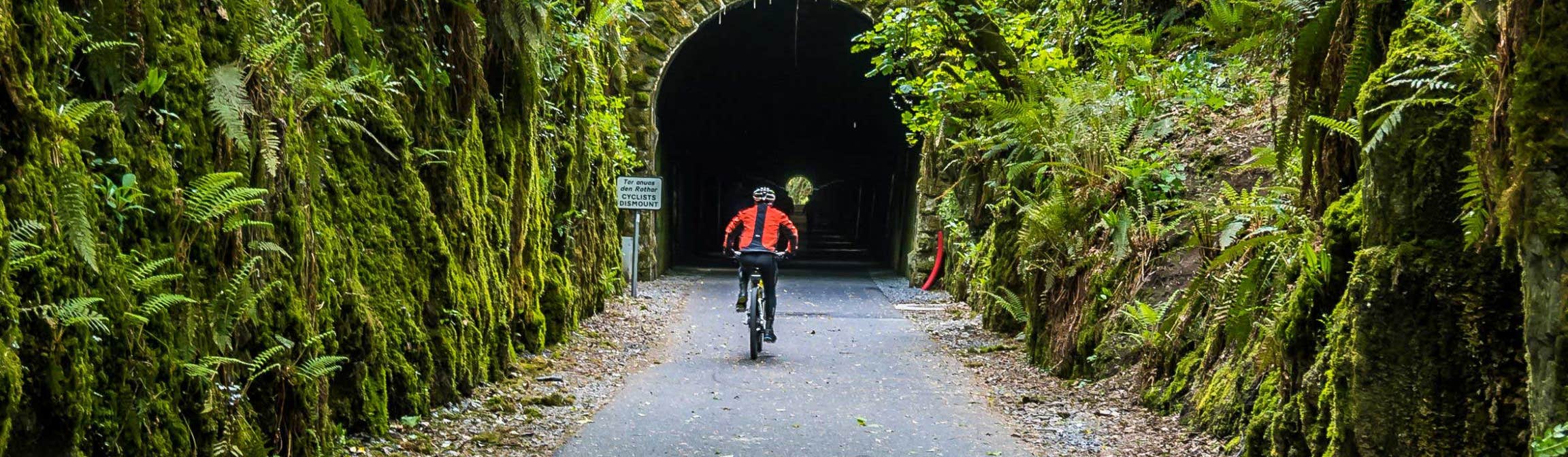 Cyclist about to enter Ballyvoyle Tunnel, Waterford Greenway, County Waterford