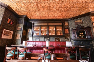 An interior view of the ceiling and wall décor in The Oval