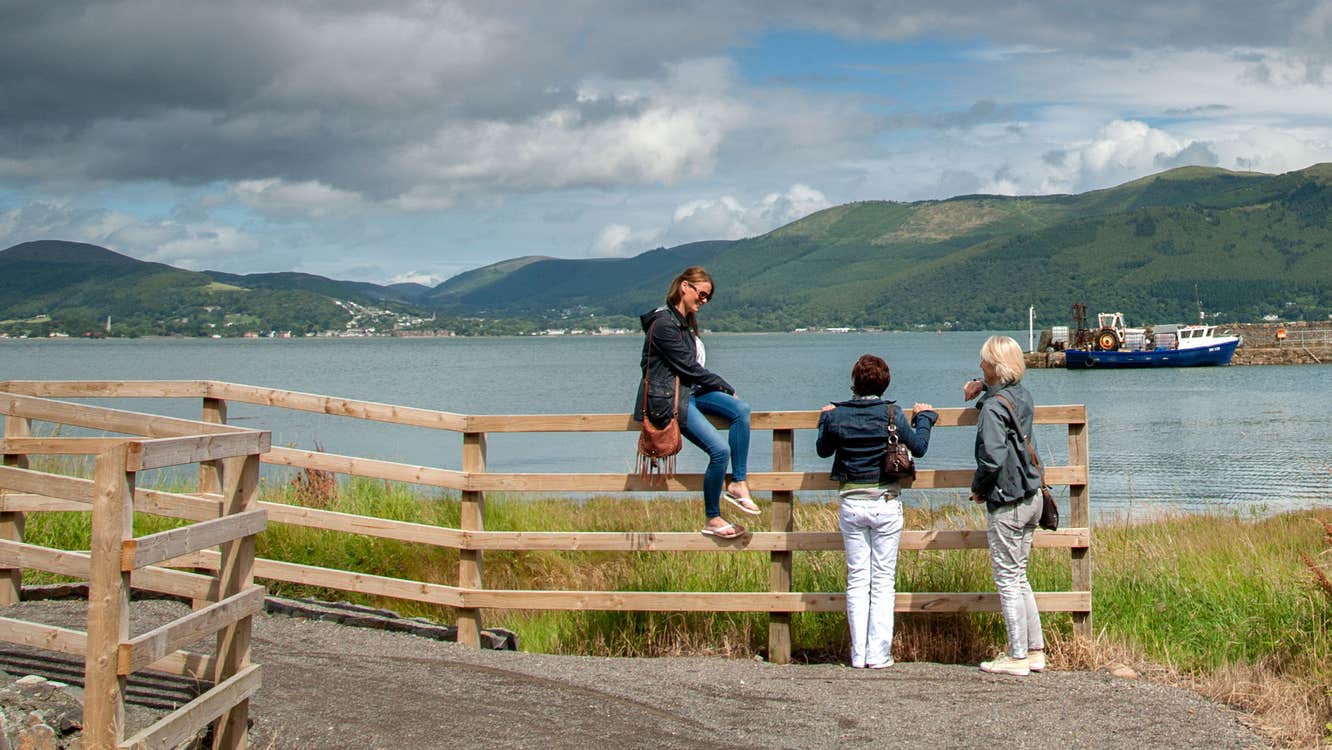 Three walkers enjoying the views from the Carlingford Greenway, County Louth