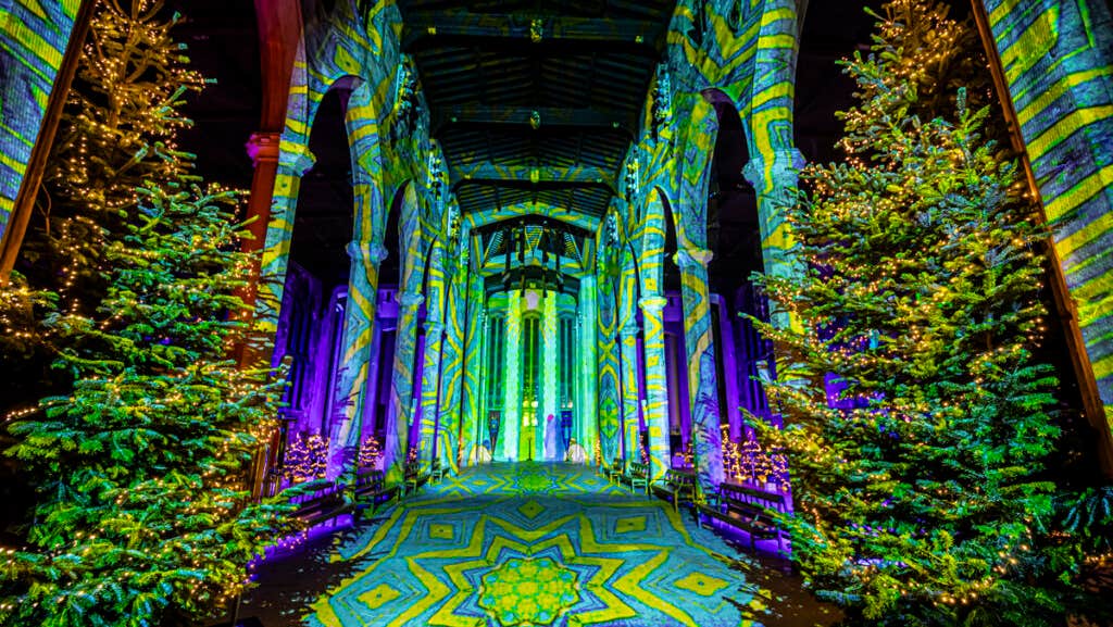 Cathedral illuminated by Luxmuralis “Starlight” – a 360° immersive light and sound show transforming the historic space into a magical Christmas journey of art, music, and wonder.