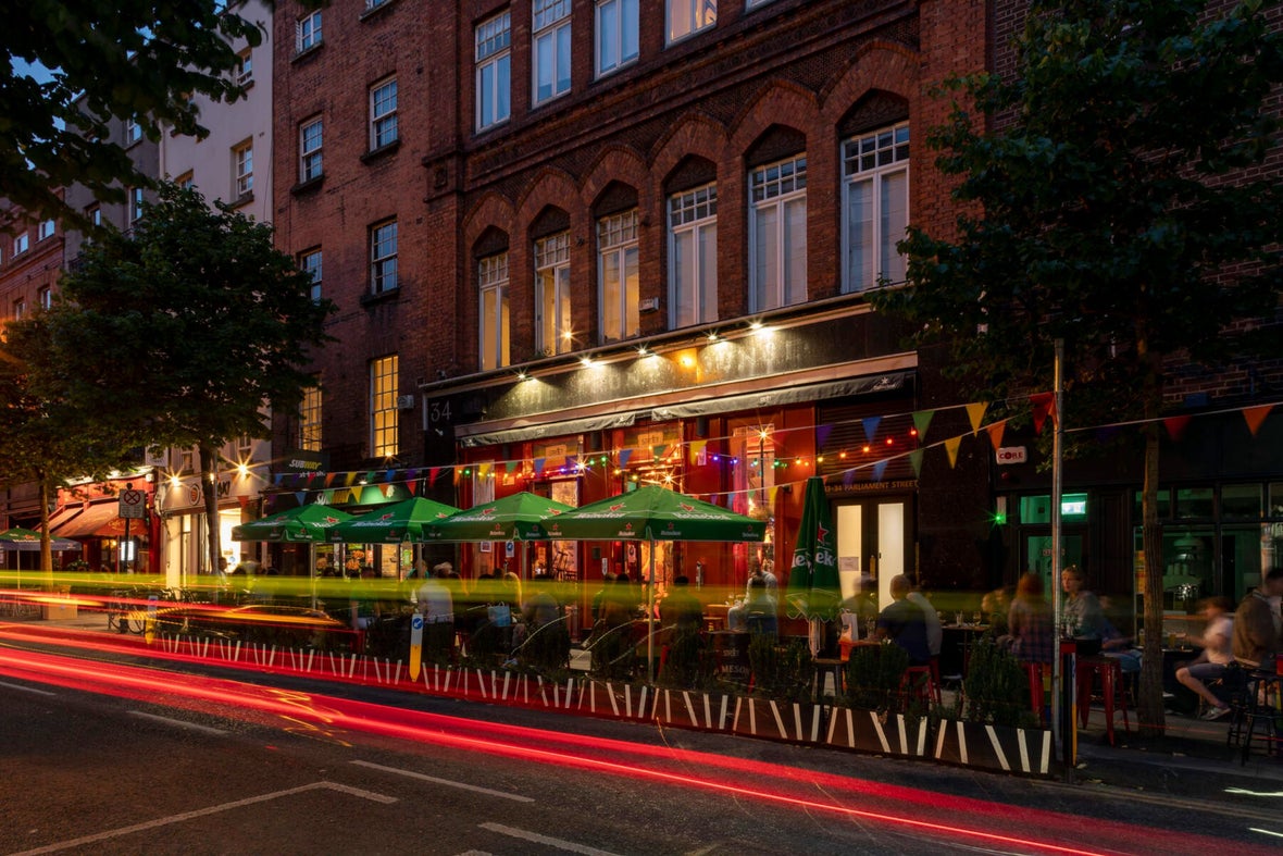 People enjoying a night out at a bar on Parliament Street.