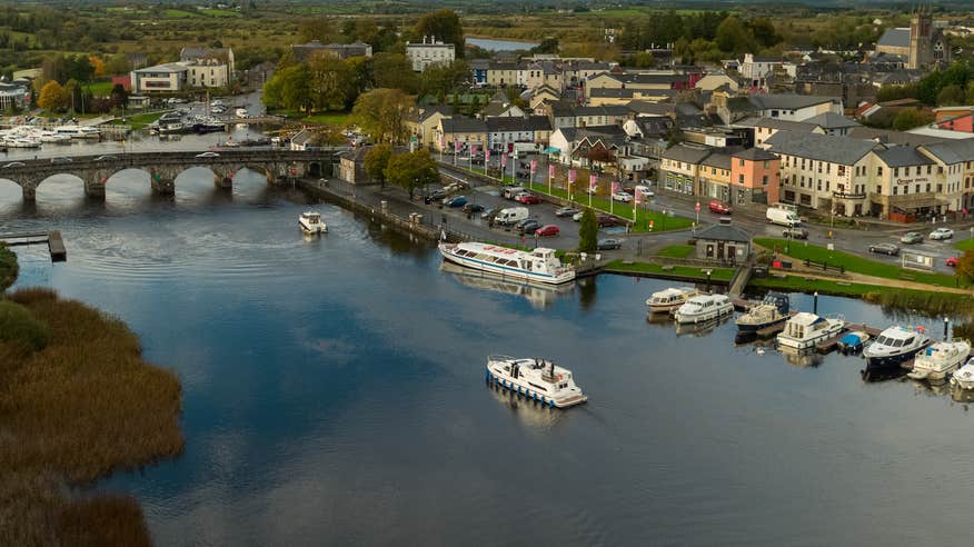A boat cruising down the Carrick-on-Shannon in Co Leitrim