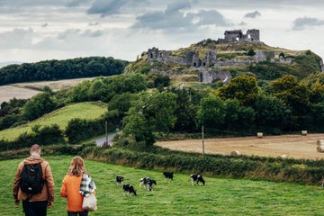 People walking towards the Rock of Dunamase in Portlaoise in County Laois