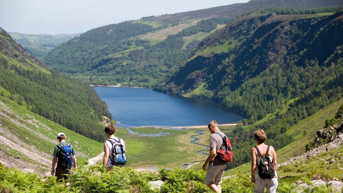 A group hiking across mountains at Glendalough, Co Wicklow