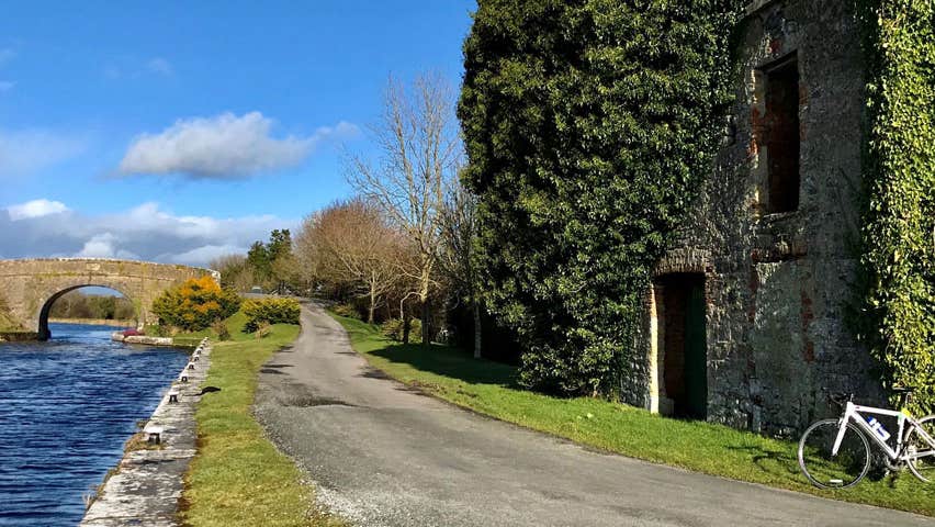 Cycle path next to the Royal Canal with bridge and ruins