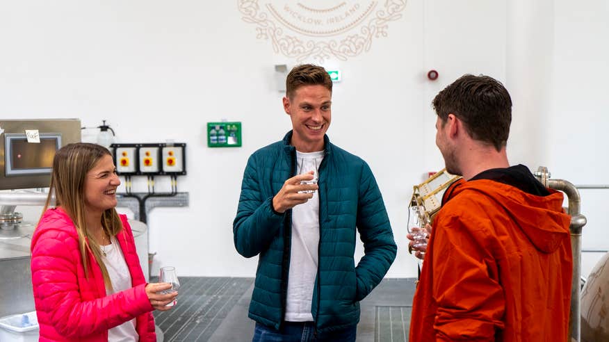 Three people touring the Powerscourt Distillery in County Wicklow.