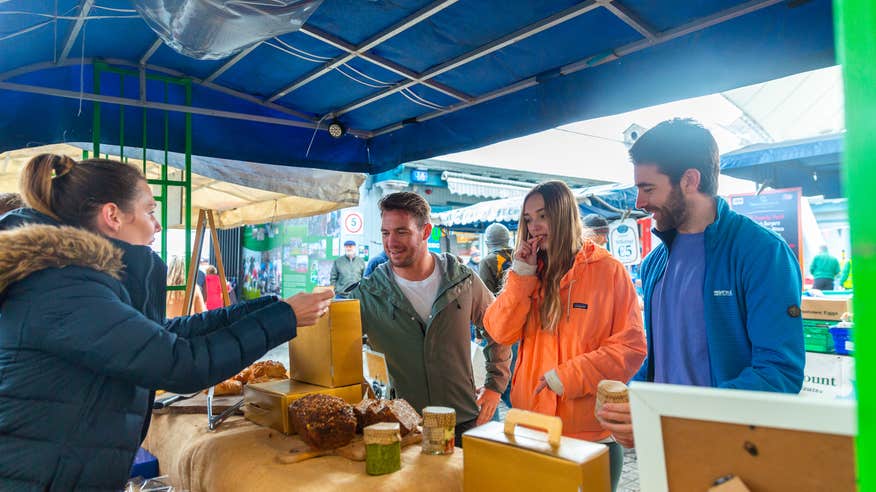 People trying foods in the Milk Market in Limerick city