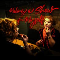 mary kate o flanagan in front of a dressing room mirror applying lipstick