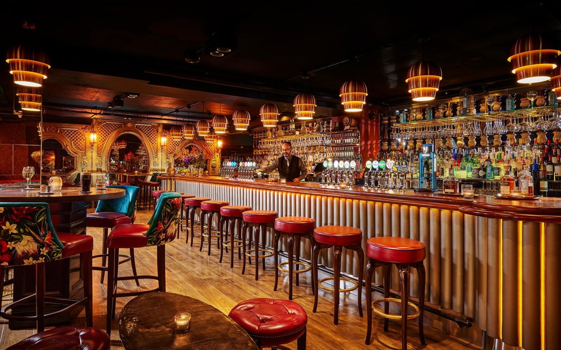 The trendy bar at Bartley's with brown and golden decor and hues throughout