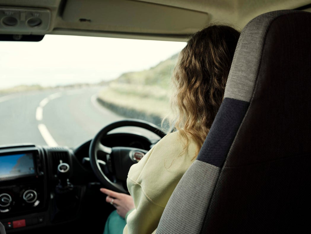 Image of a woman driving a camper van.