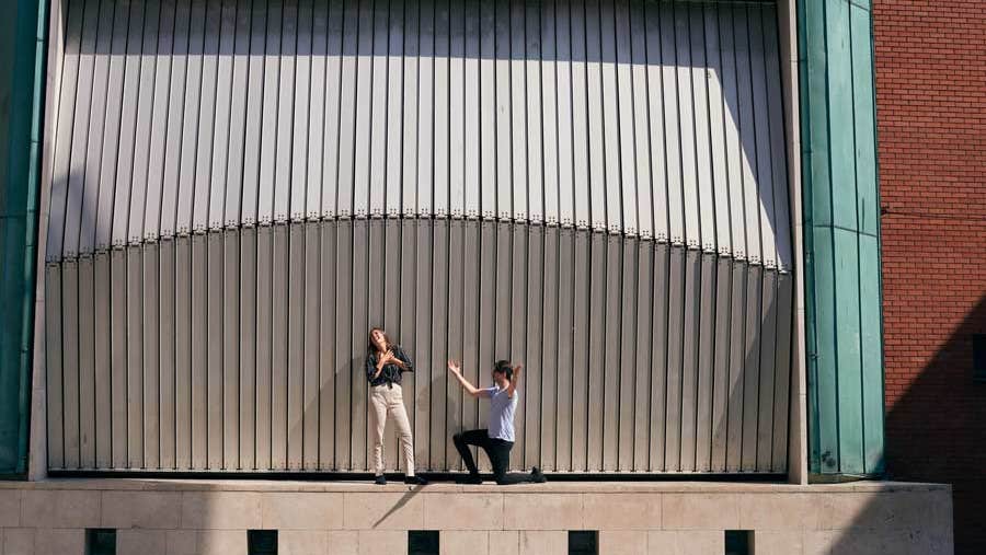 Woman and a man acting out a scene