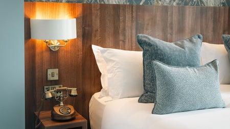 View of bed with white sheets