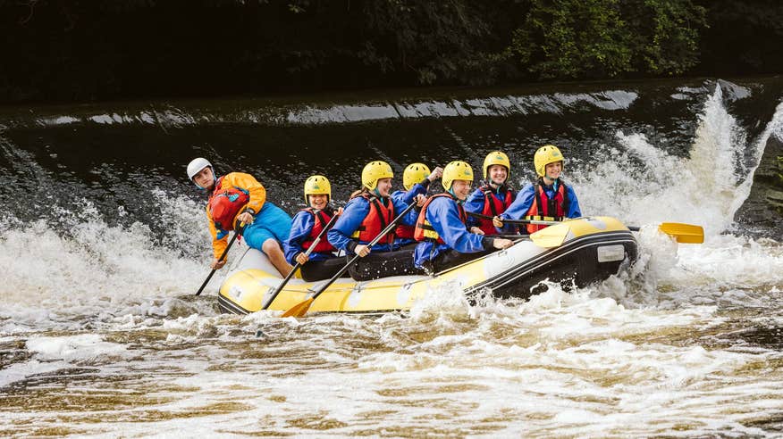 A group of people water rafting in County Dublin