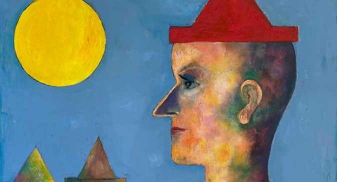 A contemplative clown stands in profile, dressed in a red hat and matching gown.