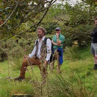People enjoying The Colony Tour and exploring the historic ruins of the Achill Mission