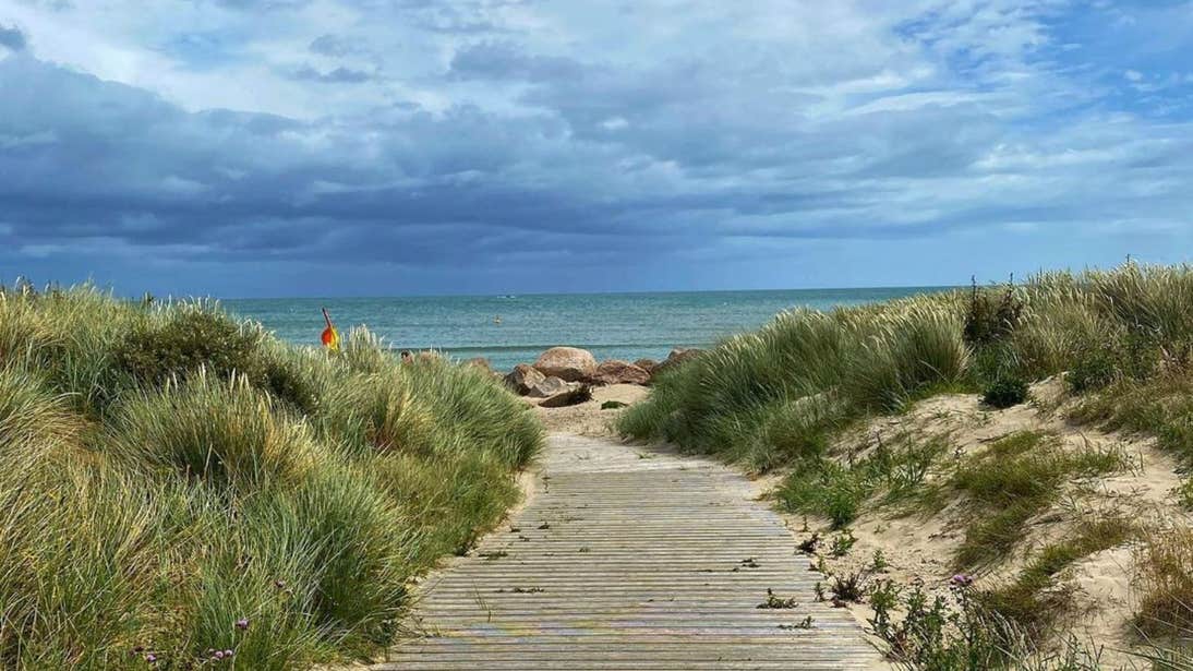 A wooden pathway leading to the shore at Carne Beach, Wexford