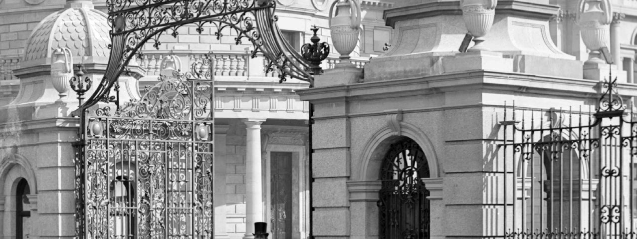 Cut & Paste No. 9 2026: Remembering Arthur Griffith, old black and white photo of gentleman walking through ornate iron gates from a Georgian building.