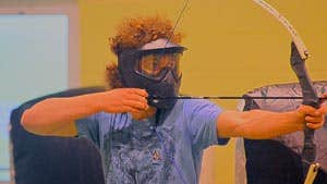 A person using a bow and arrow