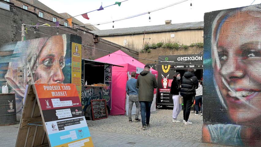 Phoenix Yard Market in Waterford, entrance with murals of two women