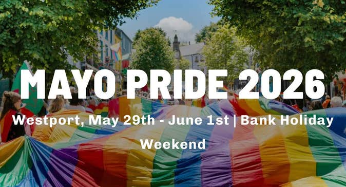A large rainbow coloured flag is being carried flat along a busy street by lots of people overlaid with white event text info.