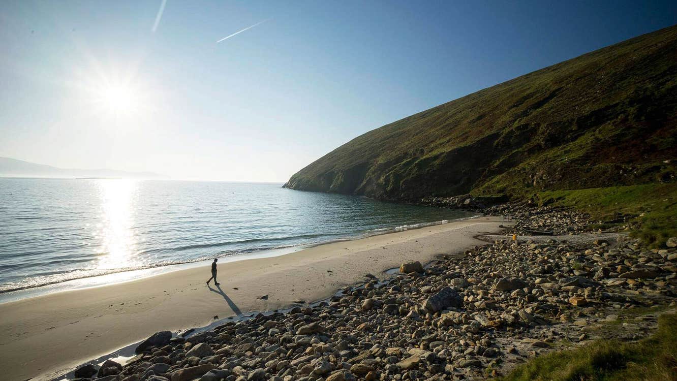 Image of walker on Keem Beach, Achill Island, County Mayo