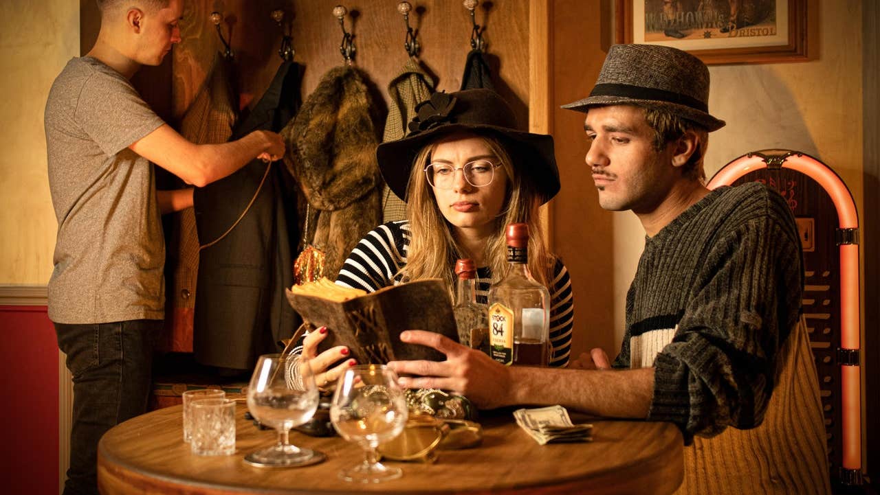 People in costume in an escape room