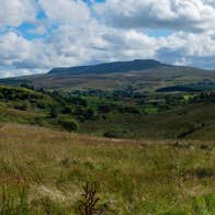 View of a distant mountain across Cavan Burren Park