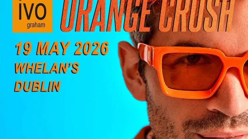 Close up view of right side only of a man's face wearing orange sunglasses