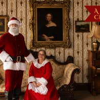 Santa and Mrs Claus pose for a photo in our drawing room.