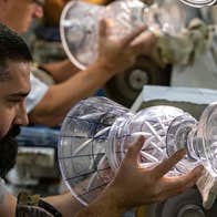 Craftsman working on a piece of Waterford crystal