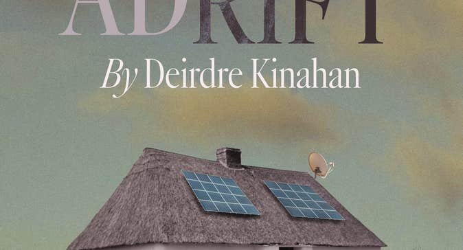 Adrift at Backstage Theatre Longford, a car parked in front of a white thatched cottage with 2 solar panels on the roof.