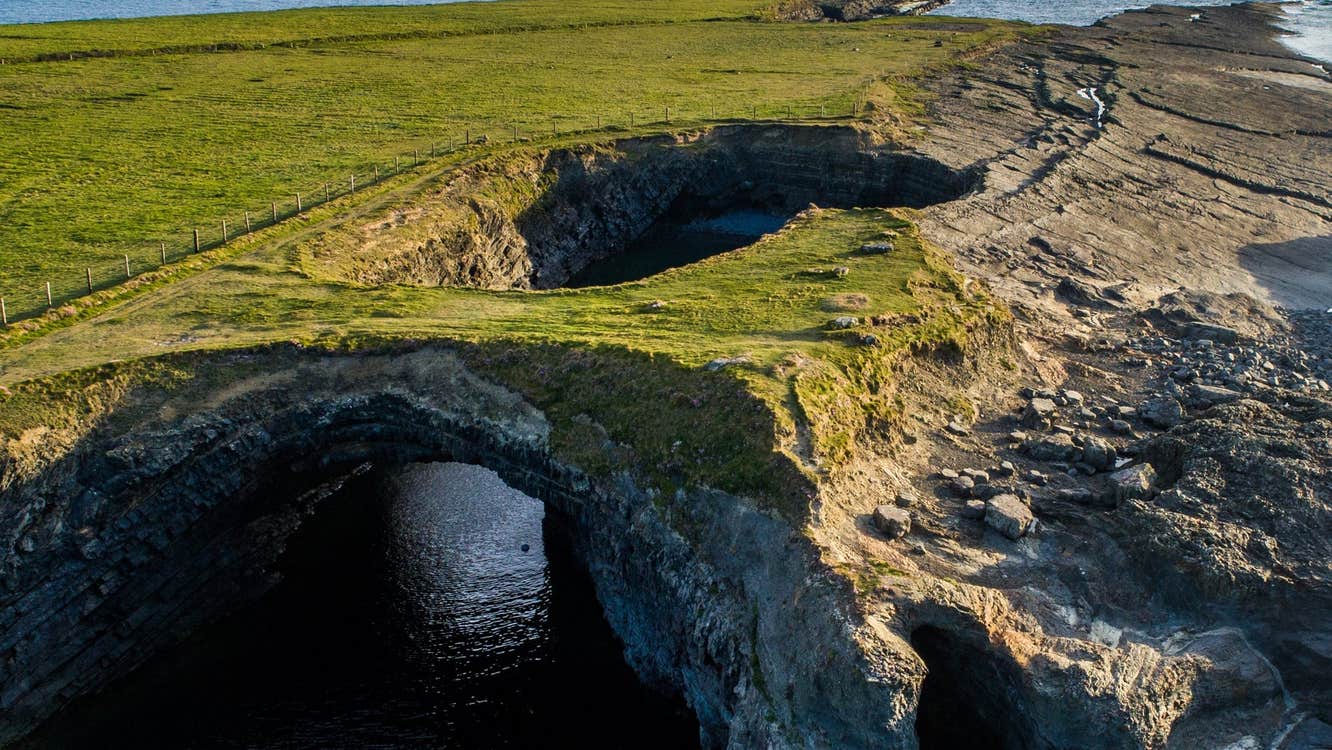 An aerial view of a sea cave at Loop Head Peninsula