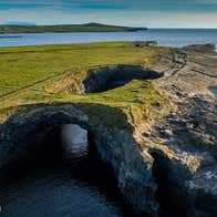 An aerial view of a sea cave at Loop Head Peninsula
