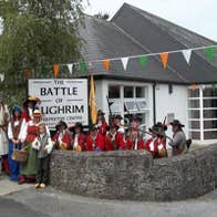 People in historical costume outside the Battle of Aughrim Visitor Centre