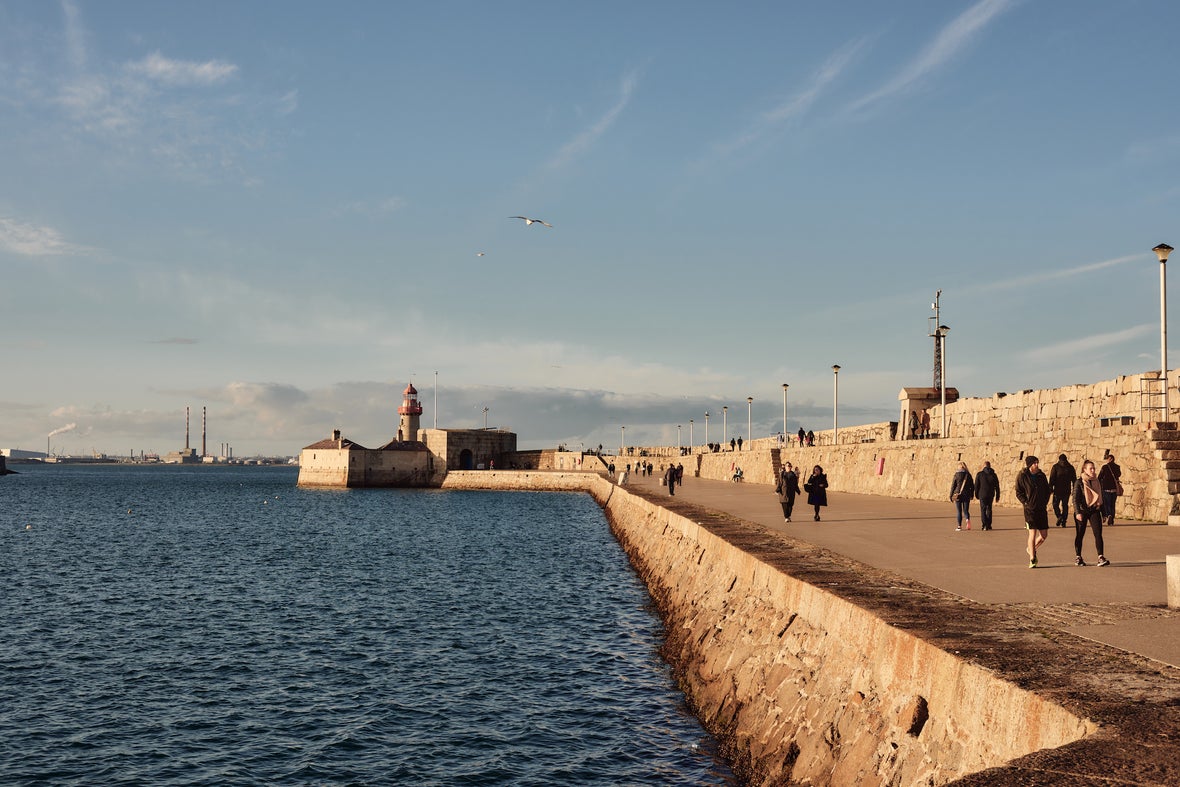 People walking along Dún Laoghaire Pier in County Dublin