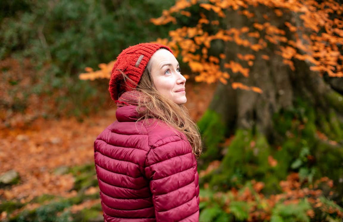 A woman in a forest in autumn