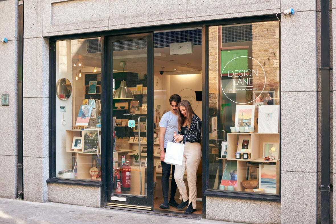 Two people leaving the store The Design Lane in Dublin City.