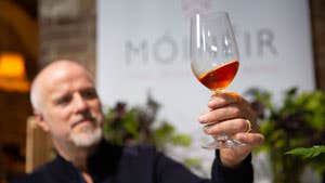 A man looking at a wine at Wicklow Way Wines