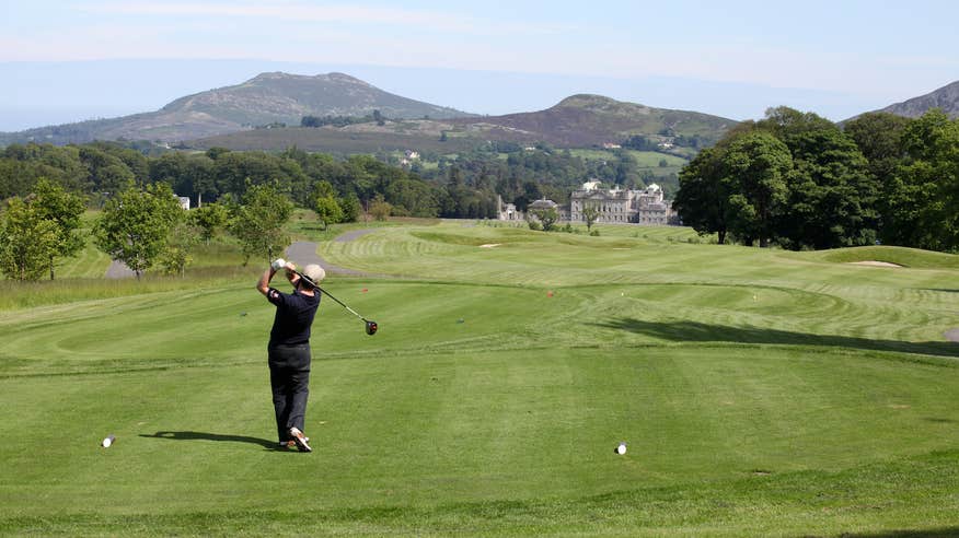 Golfer after swinging his club at Powerscourt Golf Club in Wicklow.