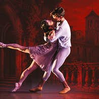 Romeo & Juliet ballet dancers embracing romantically