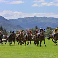 Jockeys racing during a summer racing festival at the Killarney Racecourse