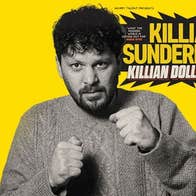 Killian Sunderland, Killian Dollar Baby - a man in knitted jumper holding his hands up in 2 fists.