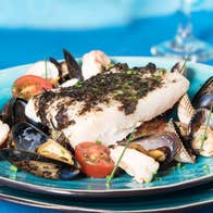 Seafood and shellfish served on a plate.