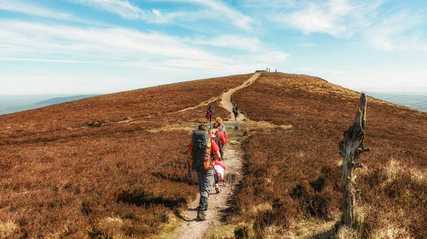 Hikers walking up a mountain in Limerick.