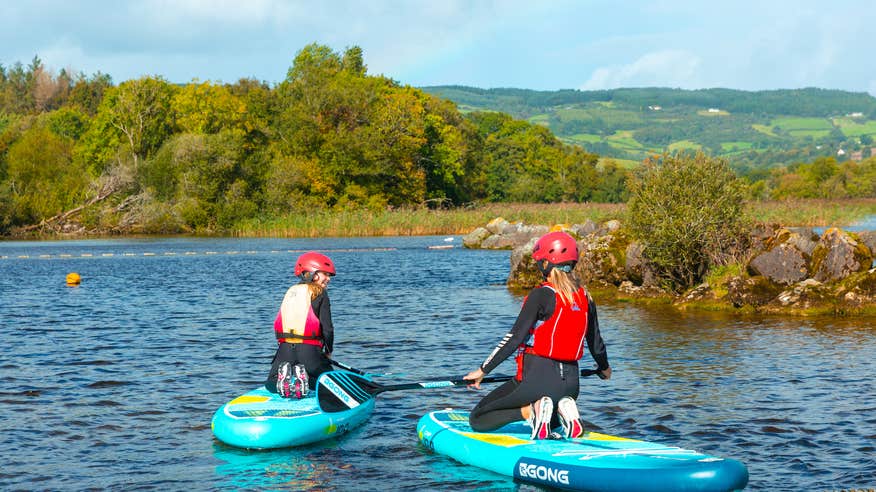 People paddle boarding at UL Sports Adventure Centre in County Clare