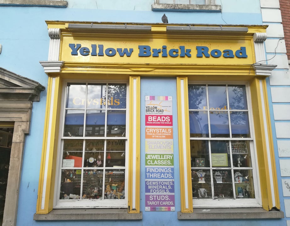 Yellow Brick Road shop exterior with yellow window frames