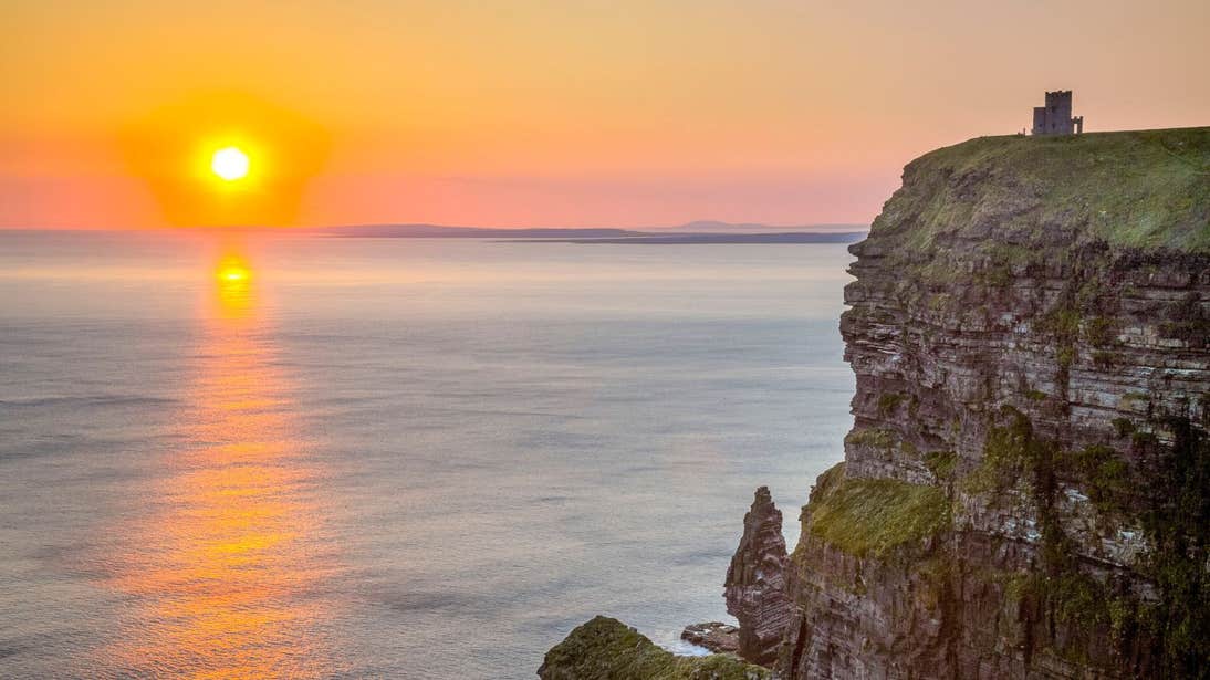 The sun setting over the Cliffs of Moher Coastal Walk, County Clare