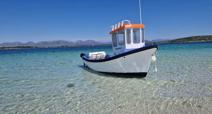 The Roundstone Bay & Island Boat Benbaun moored in the waters off Inishlacken Island