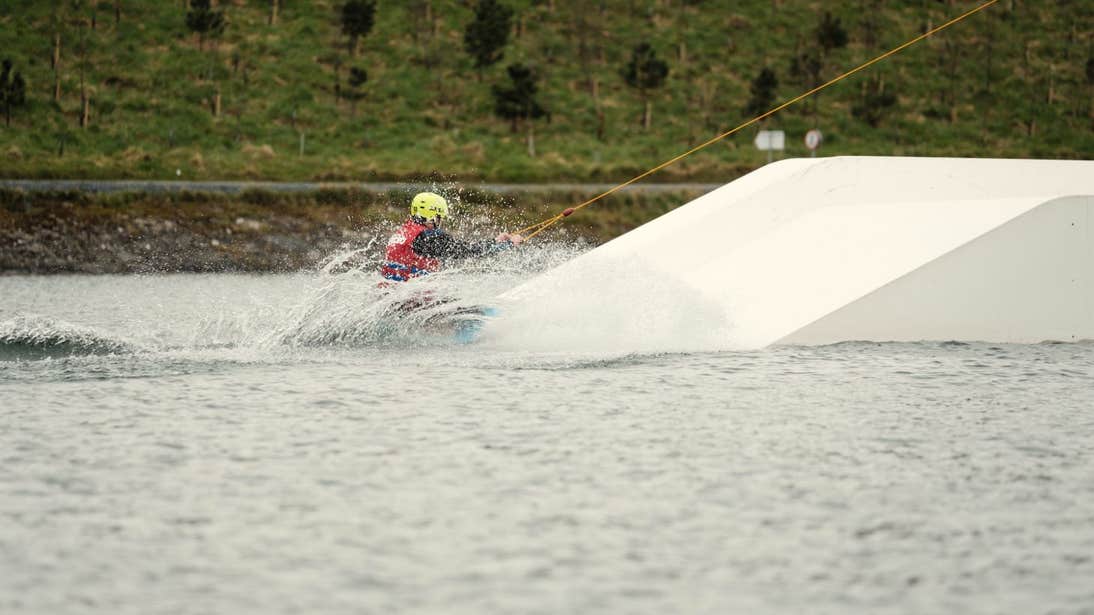 Person wearing a helmet while wakeboarding at Ballyhass Adventure Group in Cork